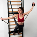 Woman using FUSE Ladder functional fitness equipment