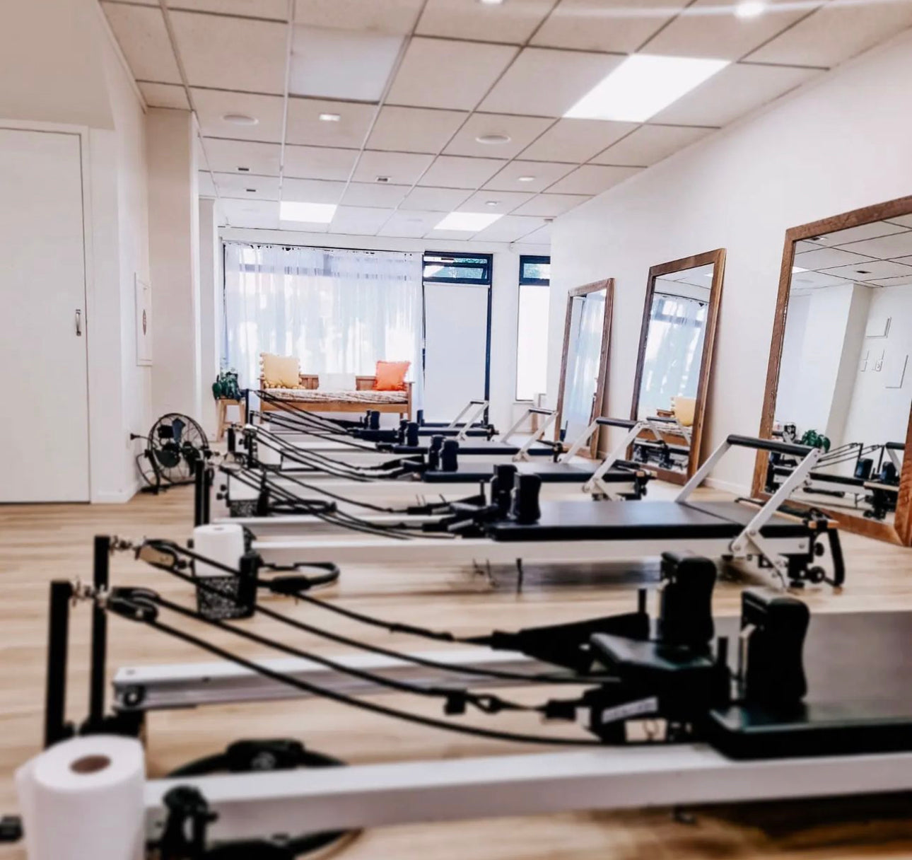 Pilates reformer studio with multiple machines