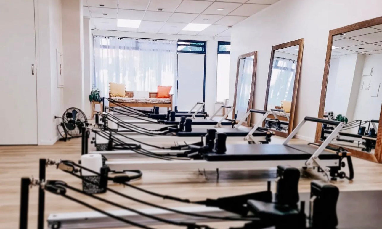 Pilates reformer studio with multiple machines