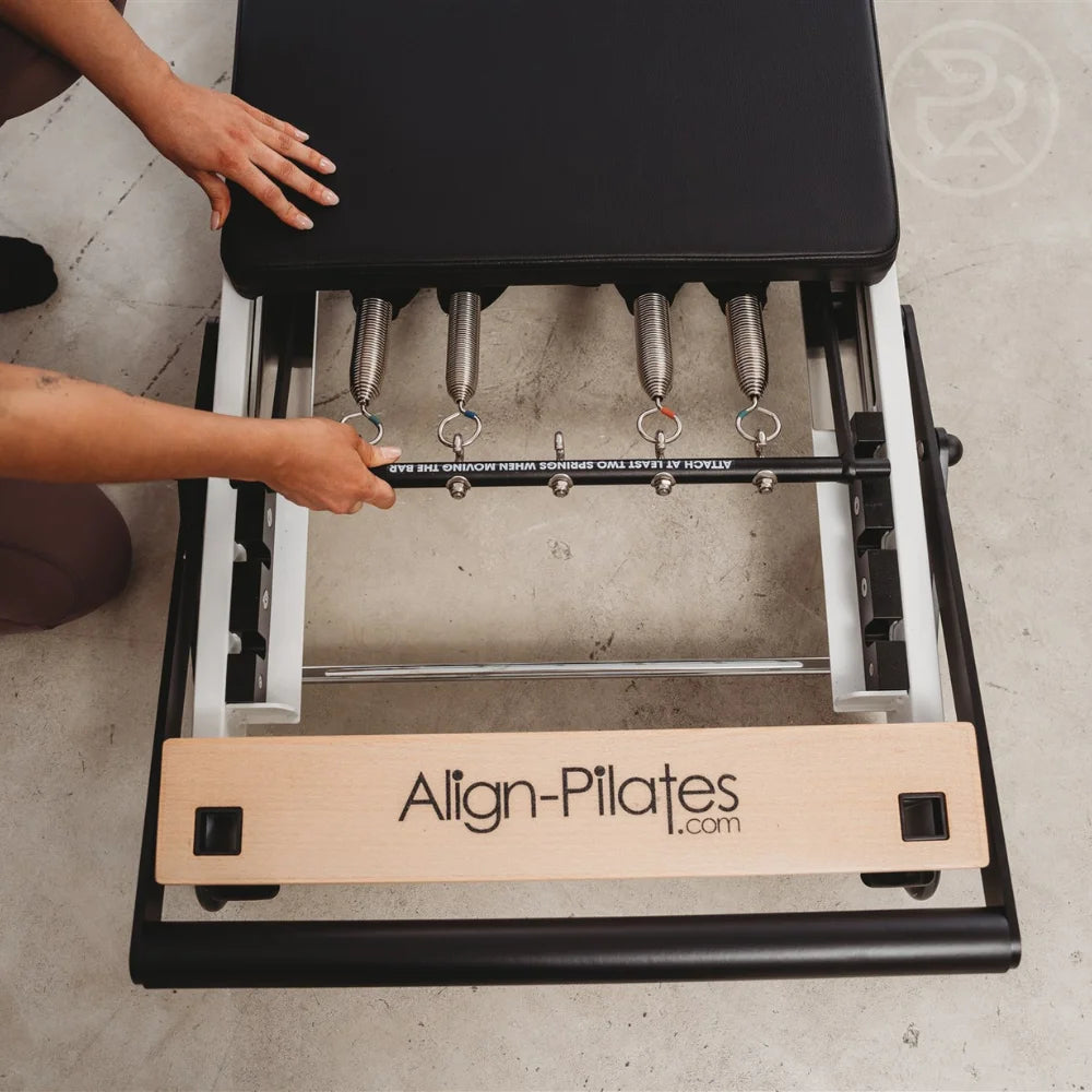 Close-up of a Pilates reformer spring system