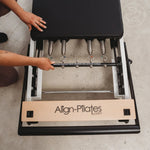 Close-up of a Pilates reformer spring system