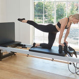 Bright home studio featuring Pilates reformer setup