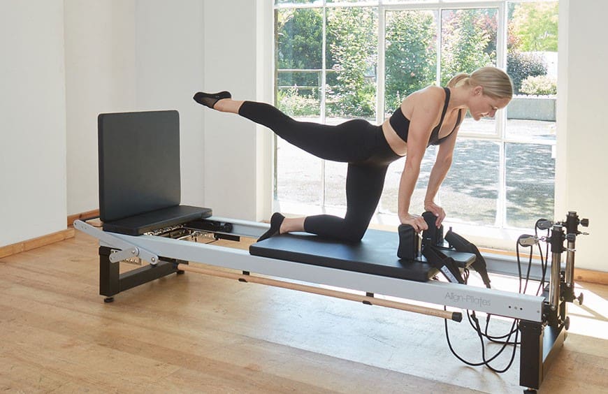Bright home studio featuring Pilates reformer setup