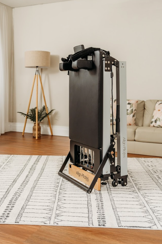 Pilates reformer equipment in home setting